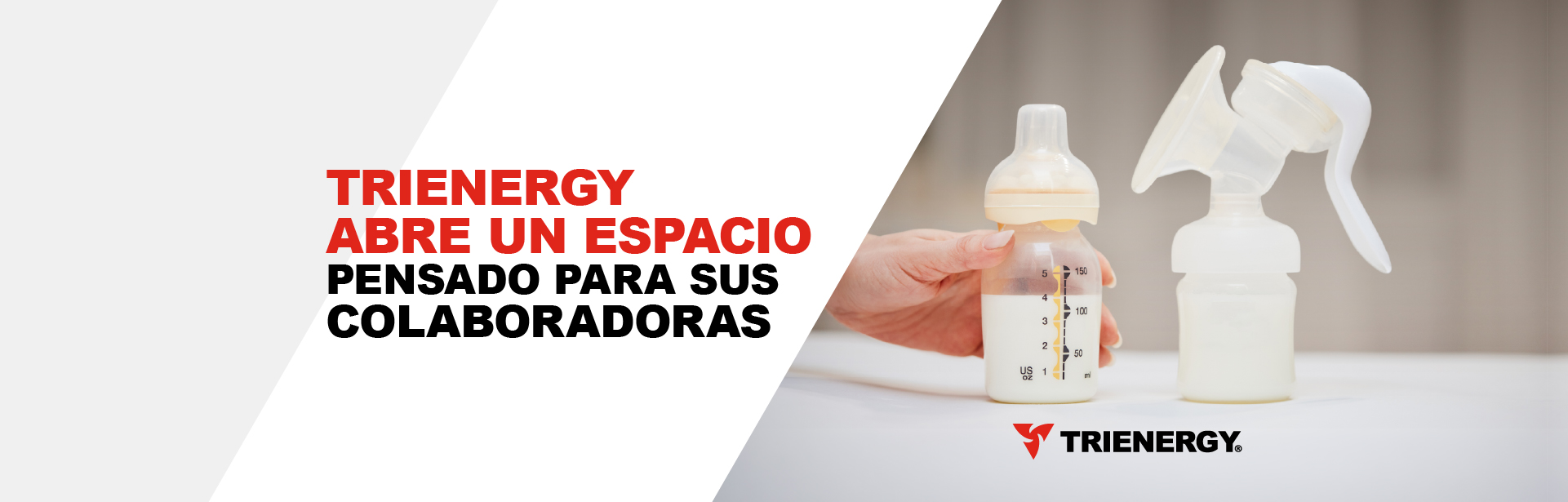 Mano sosteniendo un biberón en una sala de lactancia laboral.